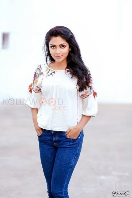 Actress Amala Paul In White Top And Blue Denim Photos