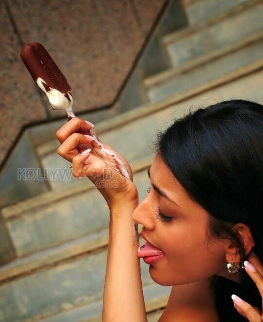 Actress Kajal Agarwal Licking And Sucking Ice Cream Photos