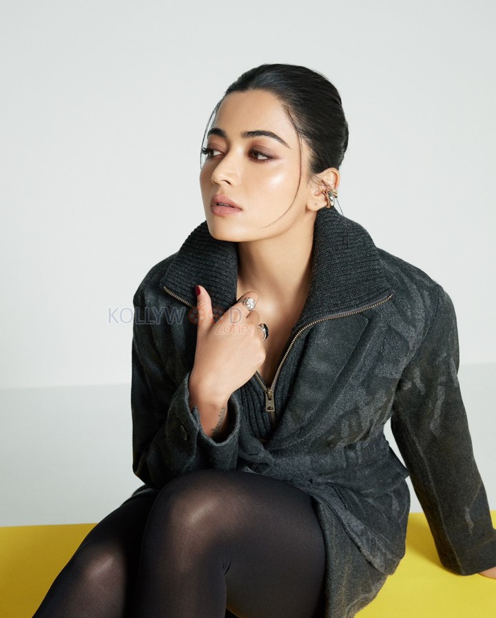 Adorable Actress Rashmika Mandanna in an Oversized Black Puff Jacket with Chic Top and Skirt with Black Leggings Photos 04