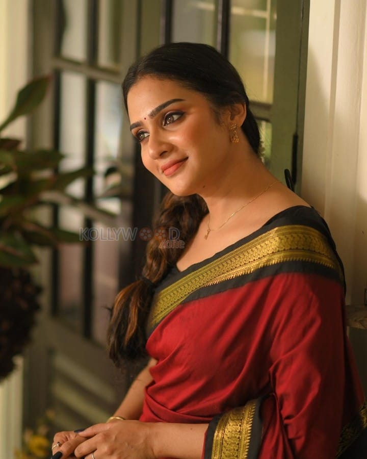 Beautiful Aditi Ravi in a Maroon Silk Saree with Contrast Black Peacock Zari Border Photos 03