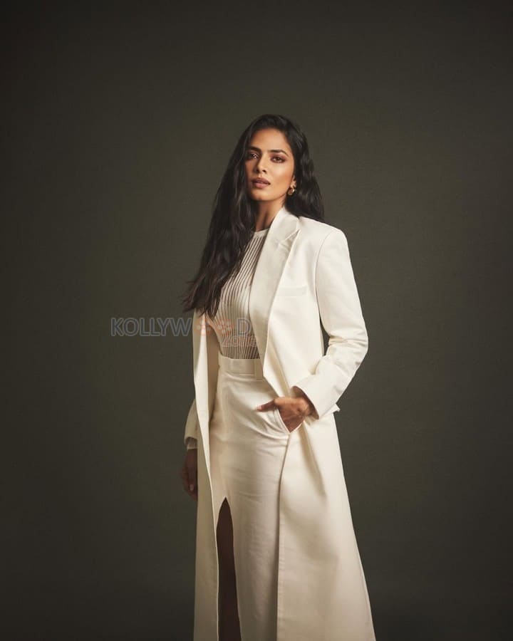 Beautiful Malavika Mohanan in an Off White Bralette with a See Through Top and Trench Coat with White Pants Photos 01
