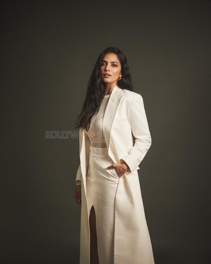 Classy Malavika Mohanan in an Off White Long Coat and Thigh Slit Skirt Photos 06