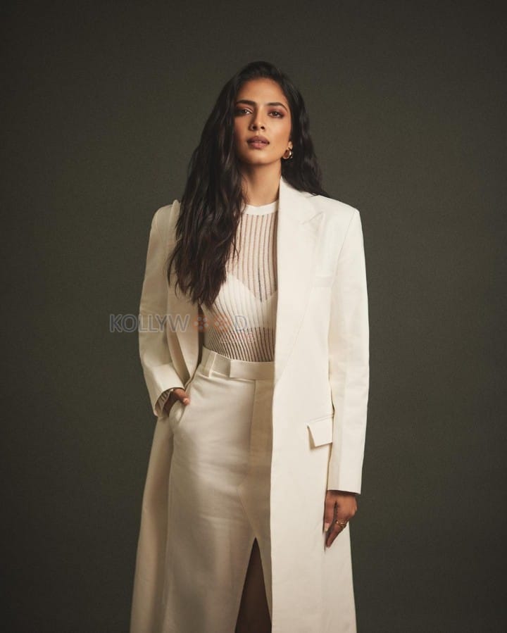 Classy Malavika Mohanan in an Off White Long Coat and Thigh Slit Skirt Photos 07