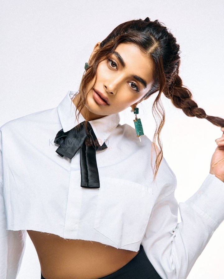 Classy Pooja Hegde in a White Full Sleeve Crop Shirt and Black Pant Photos 02