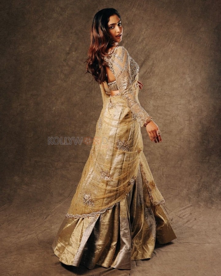 Coolie Actress Reba Monica John in a Golden Outfit Photos 03