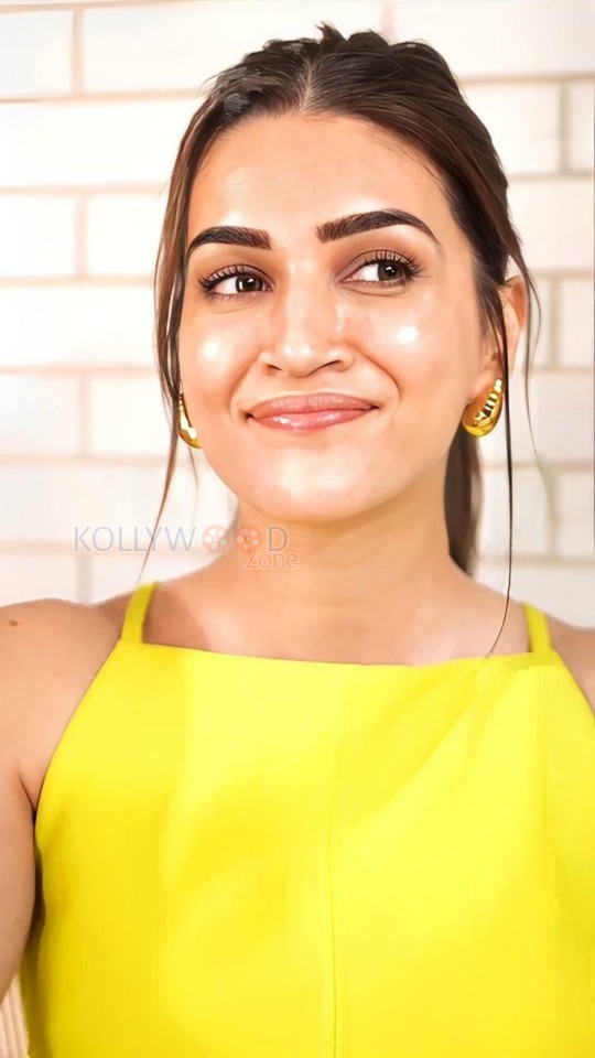 Cute Kriti Sanon in a Bright Yellow Top Pictures 01