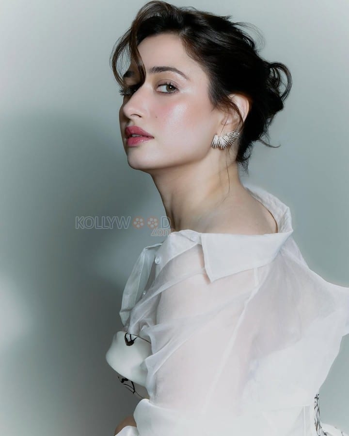 Dazzling Tamannaah Bhatia in a Stunning White Gown with Black Floral Illustrations Photos 06