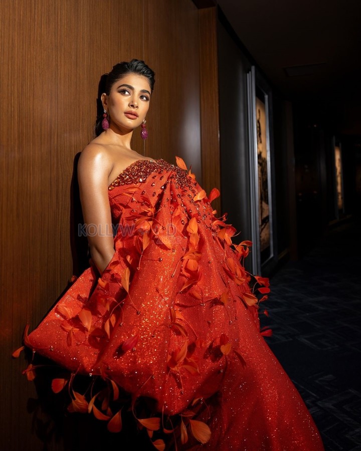 Deva Heroine Pooja Hegde in an Orange Sequined Gown Photos 02