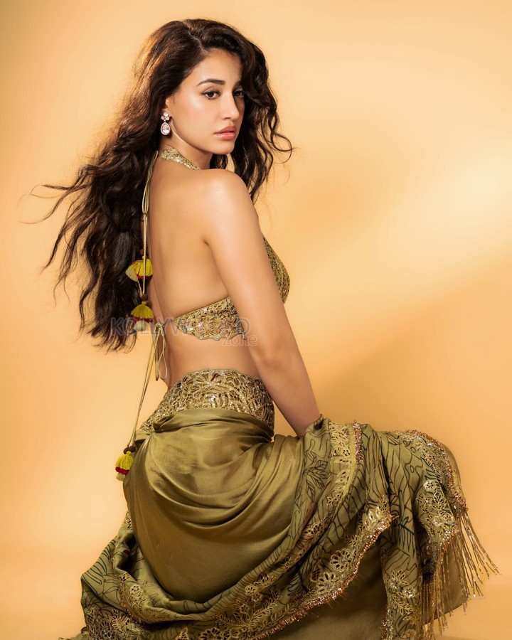 Disha Patani in a Backless Olive Green Pre Draped Skirt with a Halter Neckline Bralette and Dupatta Photos 02