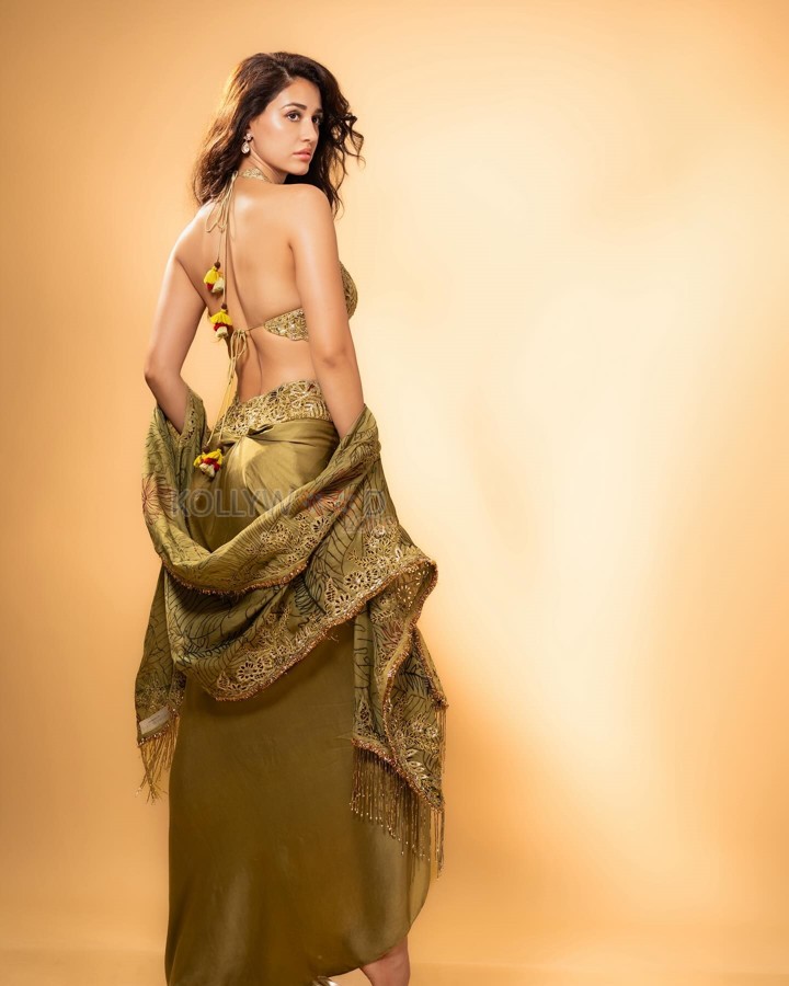 Disha Patani in a Backless Olive Green Pre Draped Skirt with a Halter Neckline Bralette and Dupatta Photos 04