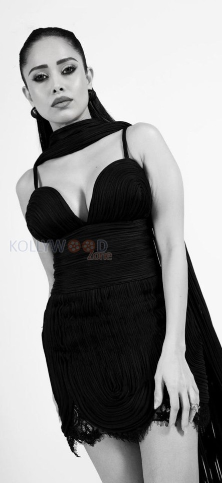 Elegant Nushrratt Bharuccha in a Black Short Dress with Plunging Neckline Photos 05