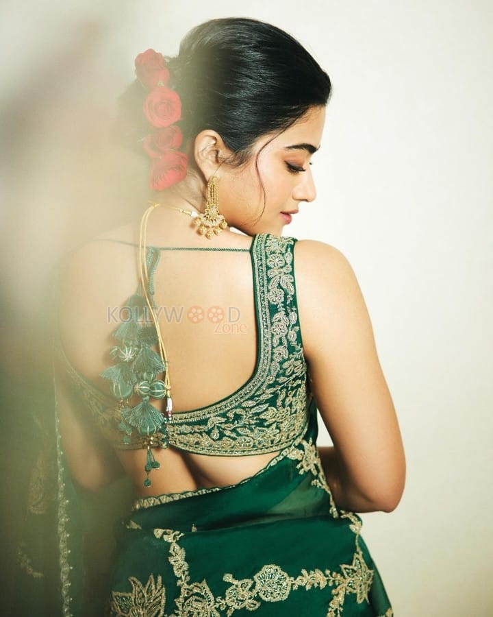 Elegant Rashmika Mandanna in an Emerald Green Saree with Sleeveless Blouse and Heart Shaped Bag Photos 01