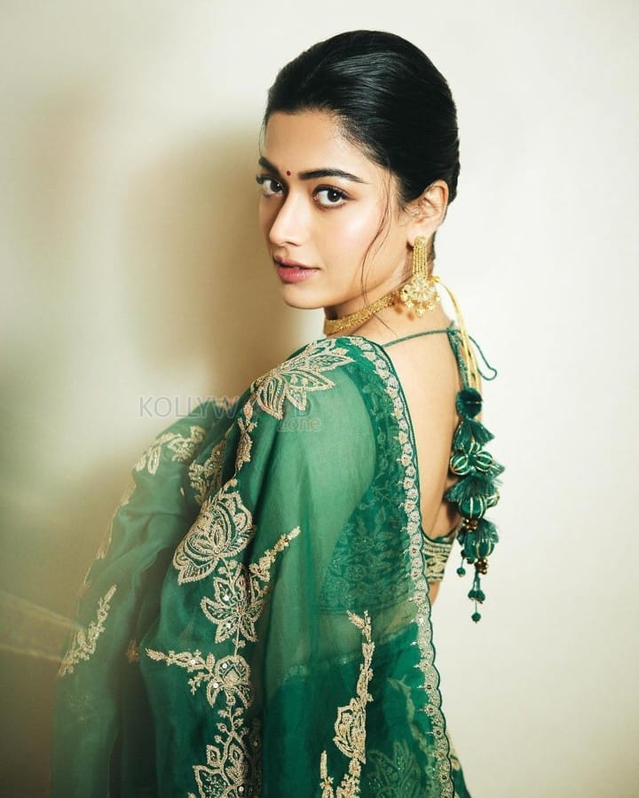 Elegant Rashmika Mandanna in an Emerald Green Saree with Sleeveless Blouse and Heart Shaped Bag Photos 05