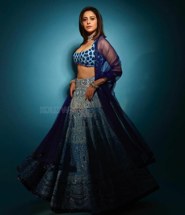 Gorgeous Nushrratt Bharuccha in a Low Neck Blue Lehenga with a Sleeveless Blouse Photos 01