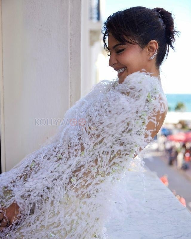 Jacqueline Fernandez in a White Mini Feathered Dress at Cannes Film Festival Photos 02