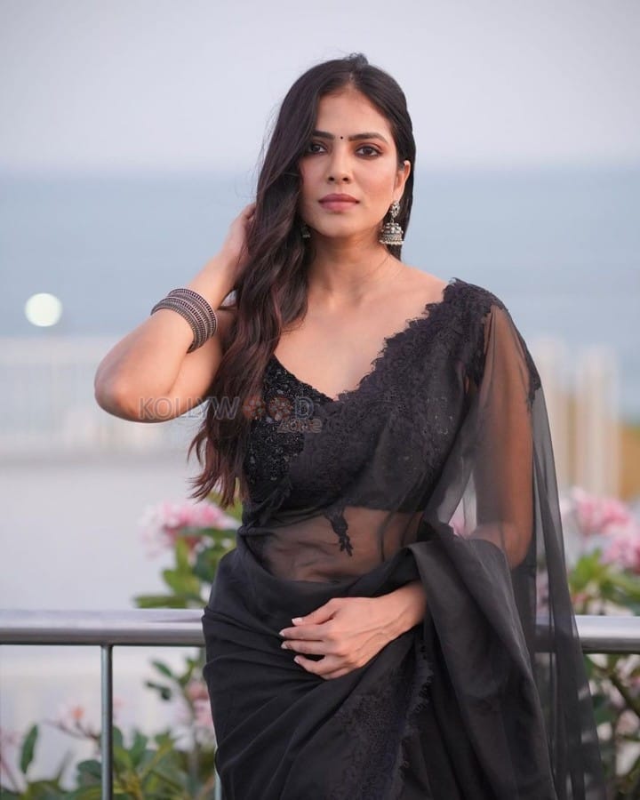 Mallu Beauty Malavika Mohanan in a Sheer Black Saree Photos 01