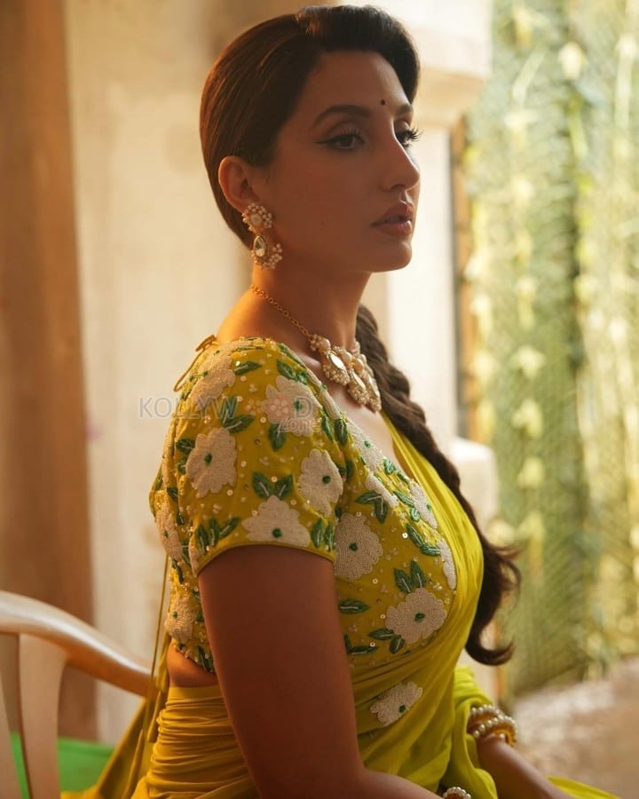 Matka Movie Actress Nora Fatehi in a Floral Lime Green Saree Photos 01