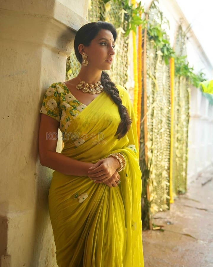 Matka Movie Actress Nora Fatehi in a Floral Lime Green Saree Photos 02