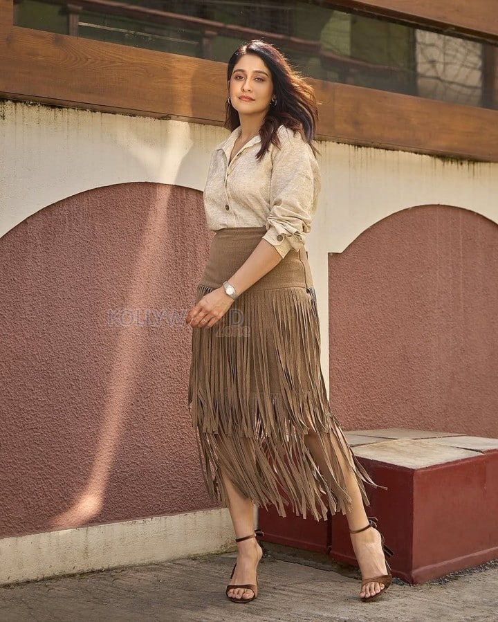 Parasakthi Heroine Regina Cassandra in a Linen Textured Shirt and Sueded Fringe Skirt Photos 05