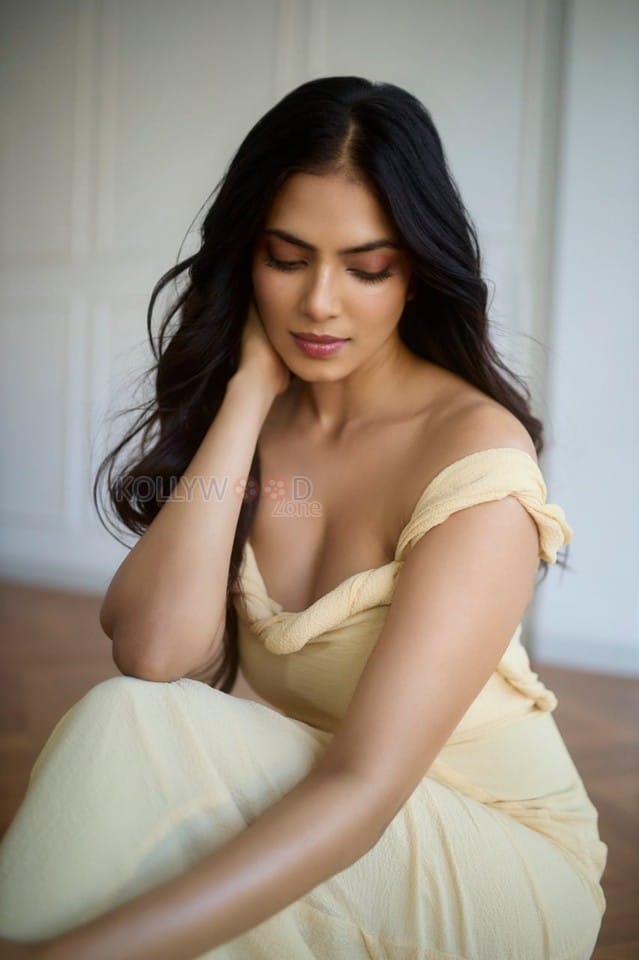 Passionate Malavika Mohanan in a Yellow Bodycon Dress Photos 03