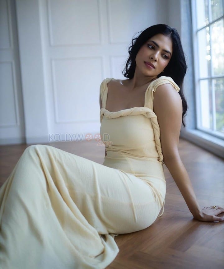 Passionate Malavika Mohanan in a Yellow Bodycon Dress Photos 05