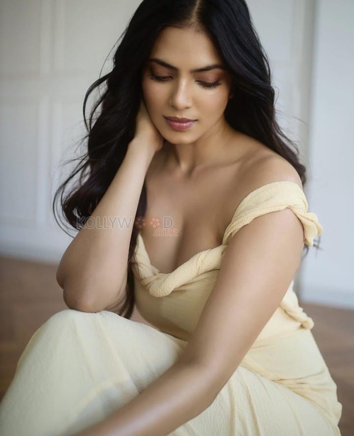 Passionate Malavika Mohanan in a Yellow Bodycon Dress Photos 09