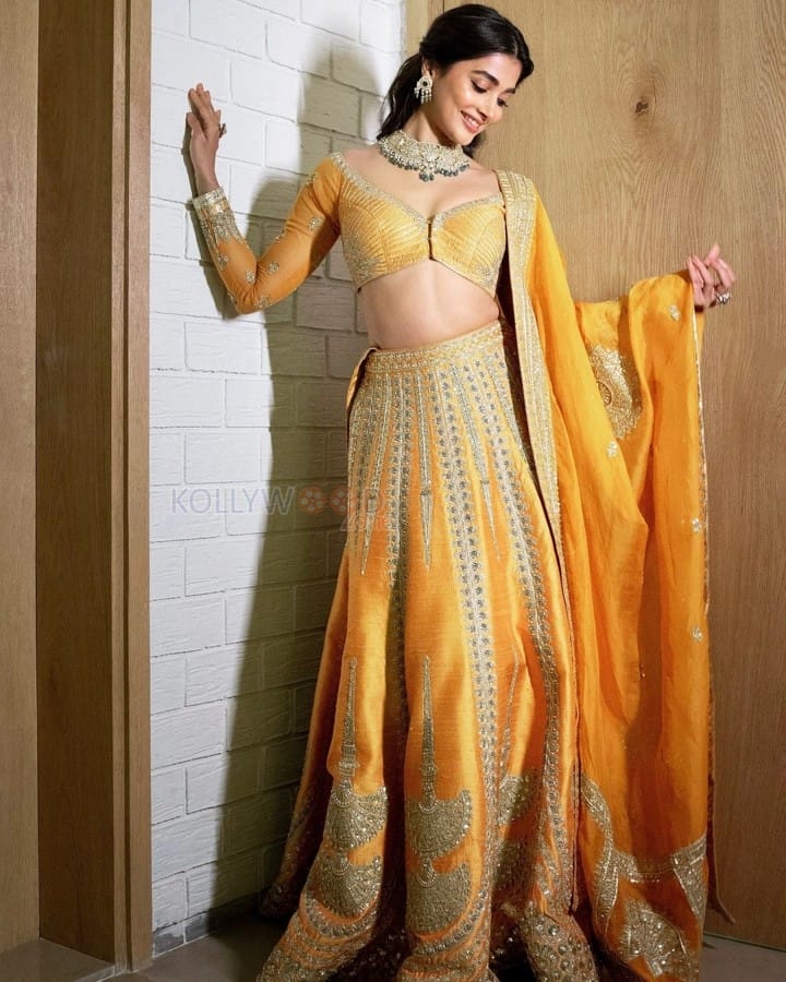 Sensuous Pooja Hegde in a Yellow Lehenga at Anant Ambani and Radhika Merchant Wedding Photos 03