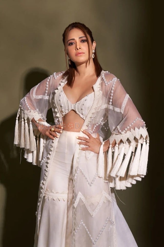 Sexy Nushrratt Bharuccha in a Vanilla Fringe Cape Sharara Photos 02