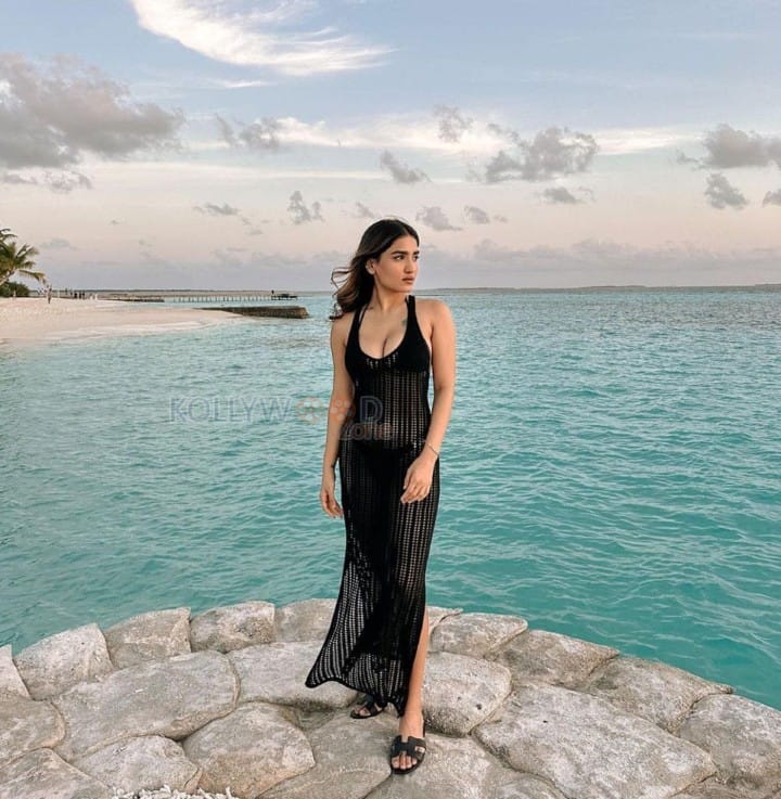 Sexy Saniya Iyappan in a See Through Black Dress Holiday Photos 02