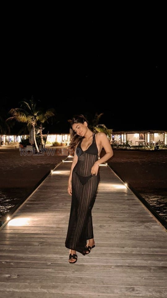 Sexy Saniya Iyappan in a See Through Black Dress Holiday Photos 03