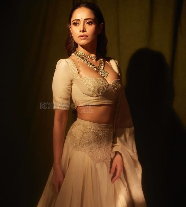 Sizzling Nushrratt Bharuccha in a Beige Lehenga with a Plunging Neckline Blouse Photos 01