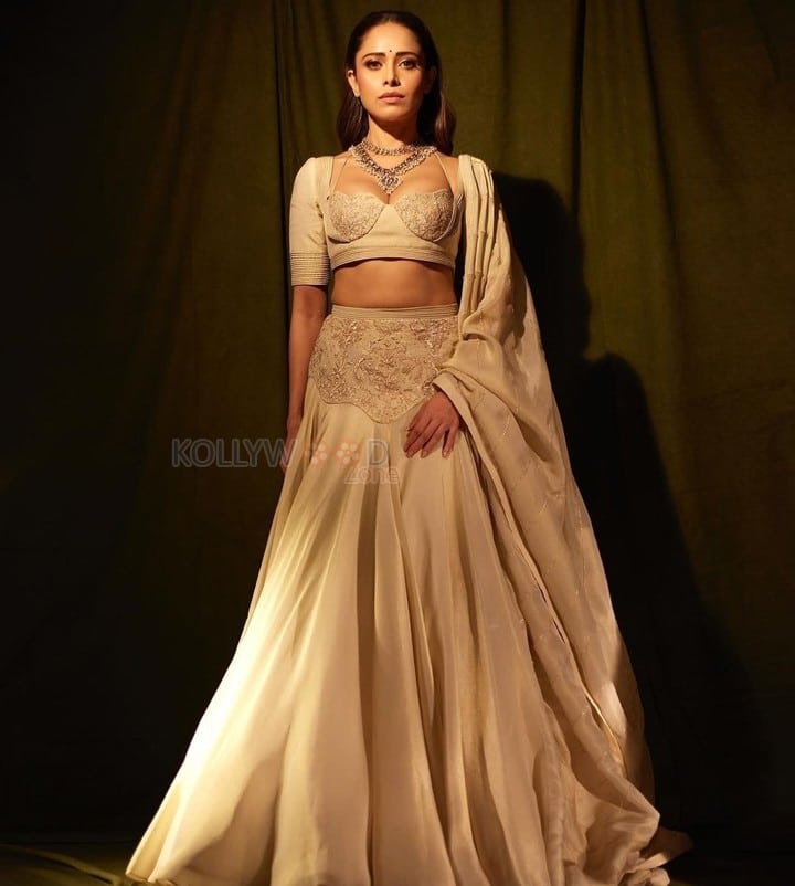 Sizzling Nushrratt Bharuccha in a Beige Lehenga with a Plunging Neckline Blouse Photos 04