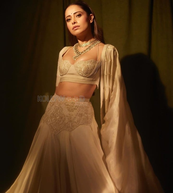 Sizzling Nushrratt Bharuccha in a Beige Lehenga with a Plunging Neckline Blouse Photos 05