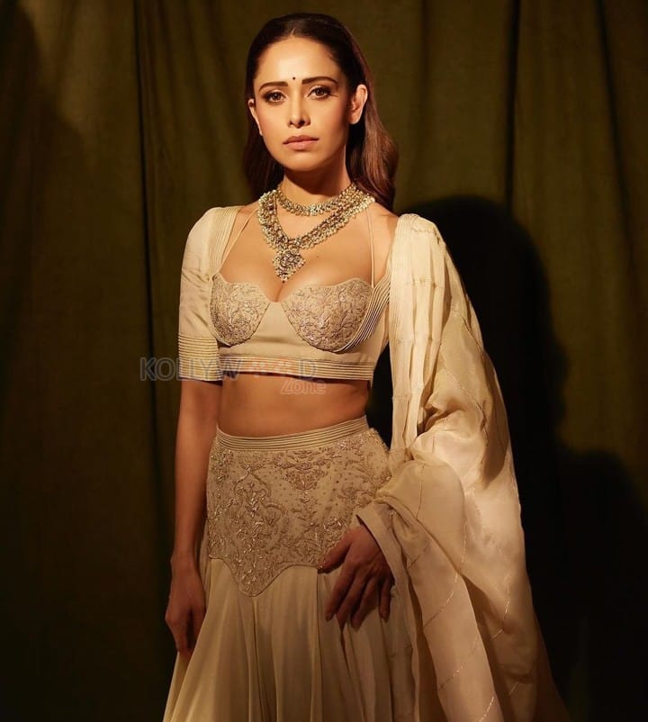 Sizzling Nushrratt Bharuccha in a Beige Lehenga with a Plunging Neckline Blouse Photos 06