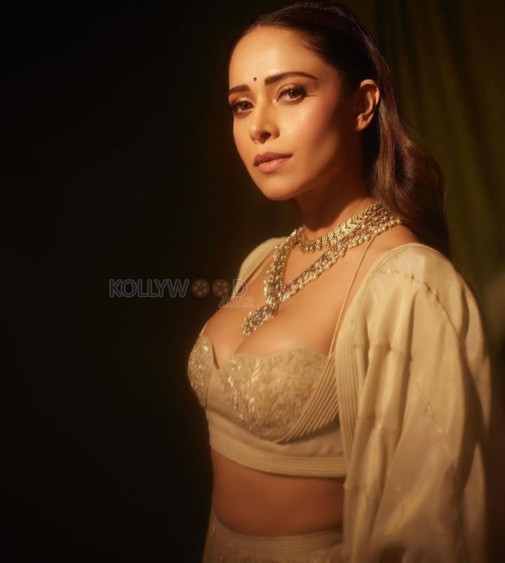 Sizzling Nushrratt Bharuccha in a Beige Lehenga with a Plunging Neckline Blouse Photos 08