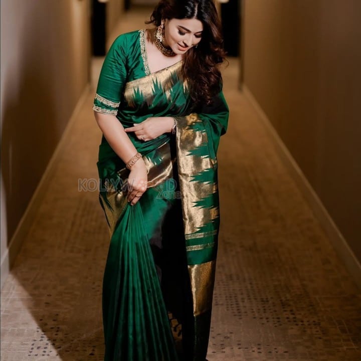 Smile Queen Sneha in a Green Silk Saree Photos 01