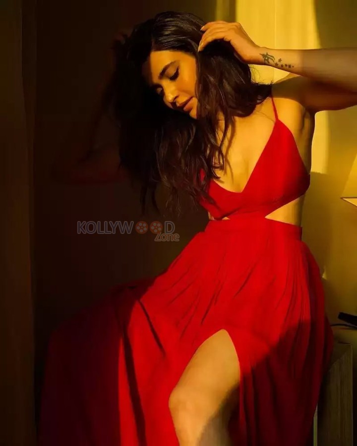 Stunning Karishma Tanna Cleavage in a Red Thigh Slit Dress with Spaghetti Strap Photos 02