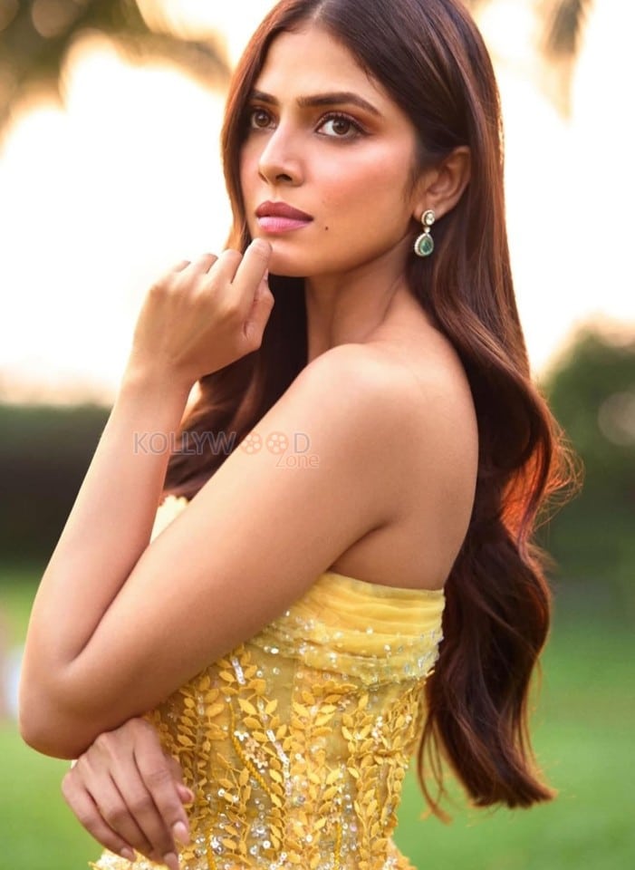 Stylish Malavika Mohanan in a Yellow Long Gown Pictures 01