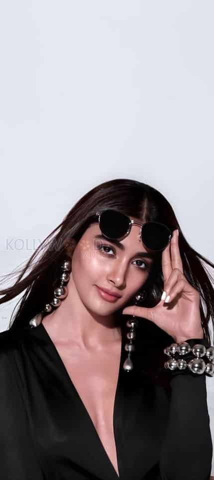 Stylish Pooja Hegde with a Sunglass on the Head Photo 01