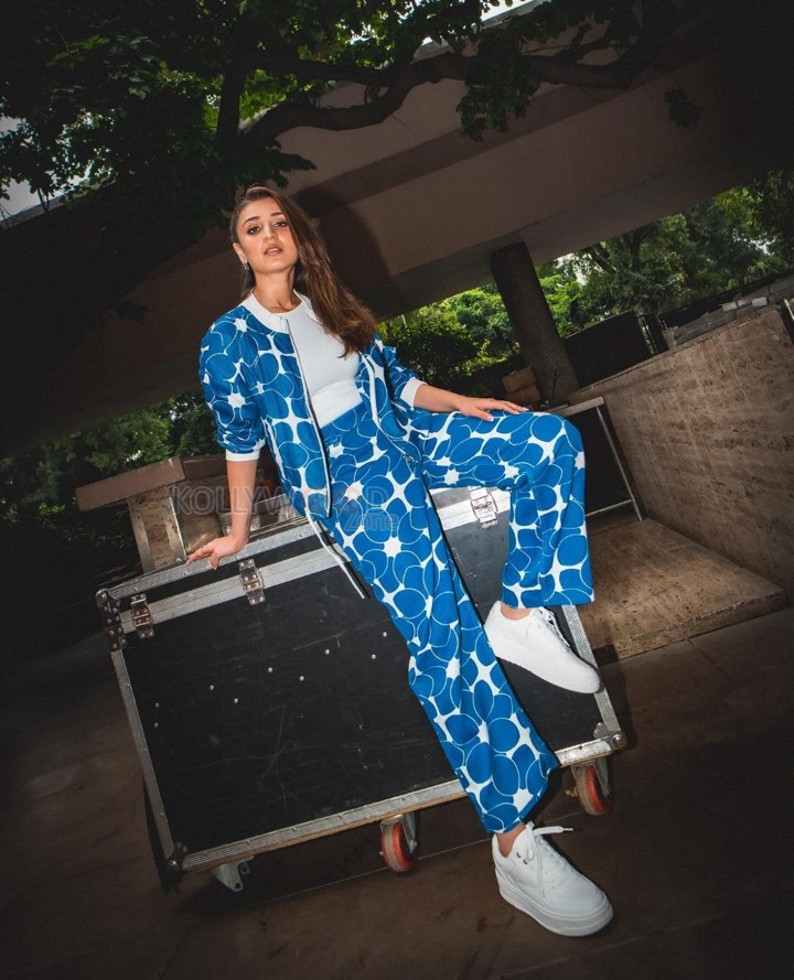 Fashionable Dhvani Bhanushali in a Blue Printed Jacket and Matching Pant with a White Crop Top Photos 04