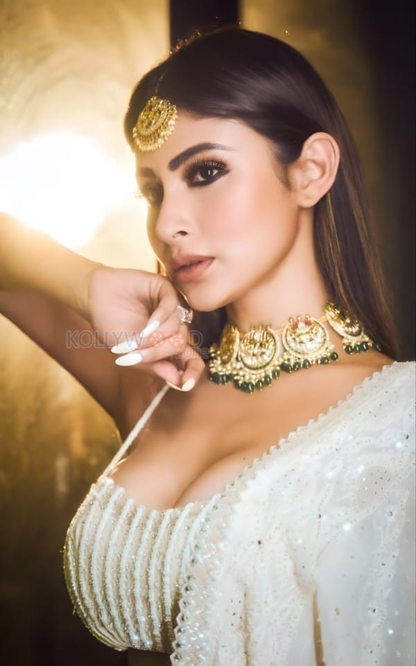 Graceful Mouni Roy in a White Lehenga Photos 03