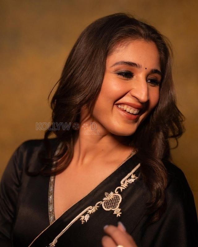 Singer Dhvani Bhanushali in a Black Silk Saree Photos 02