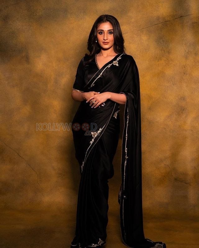 Singer Dhvani Bhanushali in a Black Silk Saree Photos 03