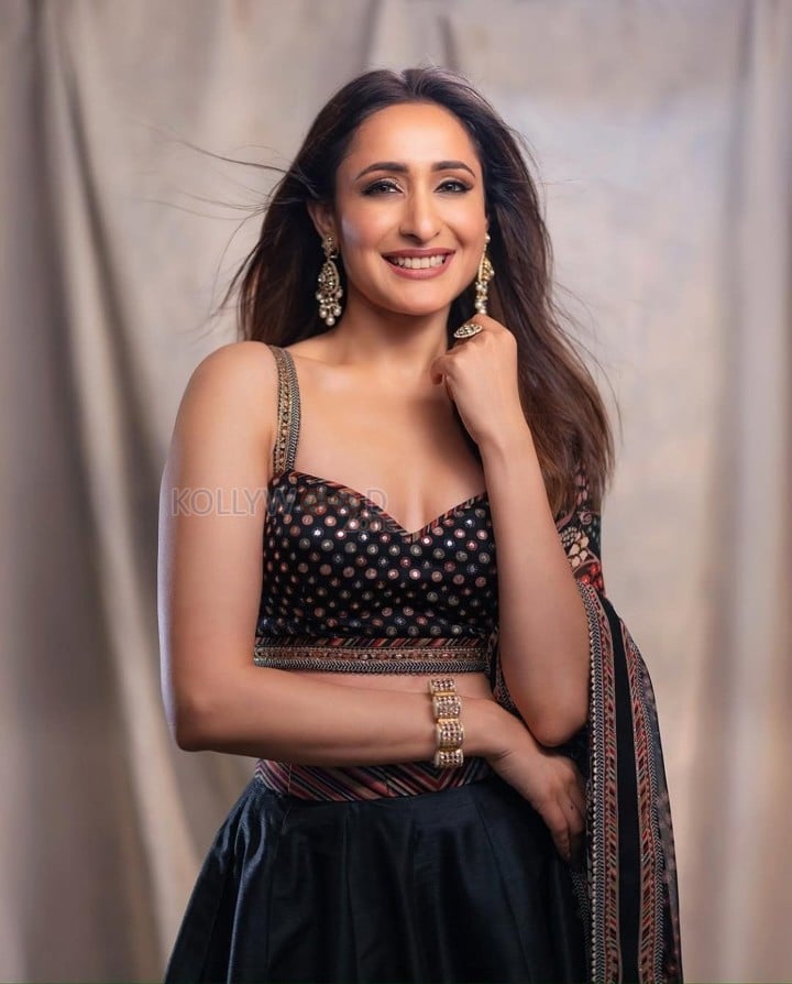 Akhanda 2 Actress Pragya Jaiswal in a Midnight Blue Floral Lehenga with a Sleeveless Blouse Photos 02