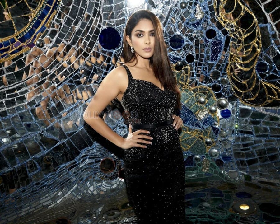 Alluring Mrunal Thakur in a Black Backless Bodycon Black Pearl Studded Dress Pictures 02