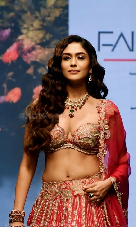 Attractive Mrunal Thakur in a Red Lehenga at Bombay Times Fashion Week Photos 02