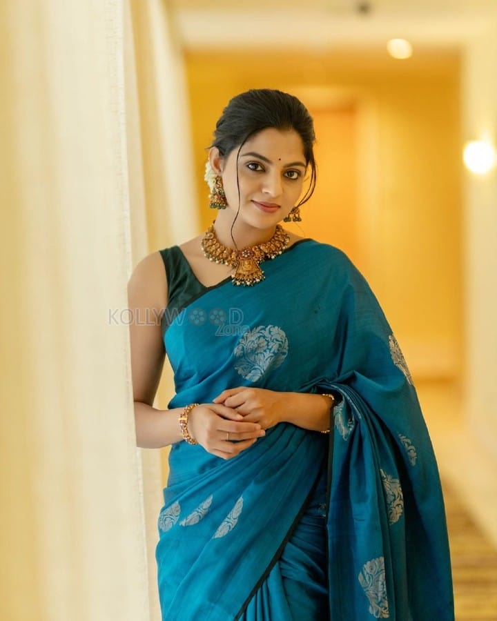 Beautiful Nikhila Vimal in a Peacock Blue Saree Photos 03