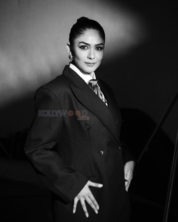 Boss Beauty Mrunal Thakur in an Oversized Black Jacket with Black Shorts and White Shirt Photos 01