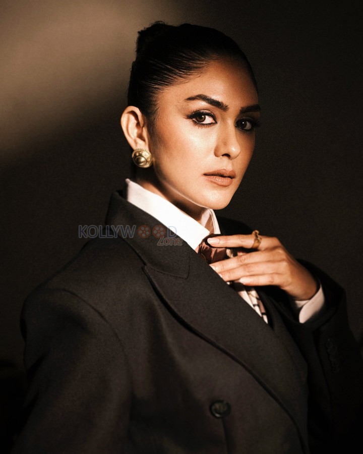 Boss Beauty Mrunal Thakur in an Oversized Black Jacket with Black Shorts and White Shirt Photos 08