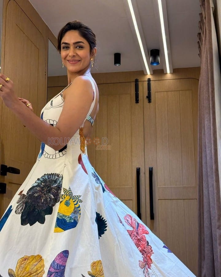 Charming Mrunal Thakur in a White Floral Printed Dress Photos 06